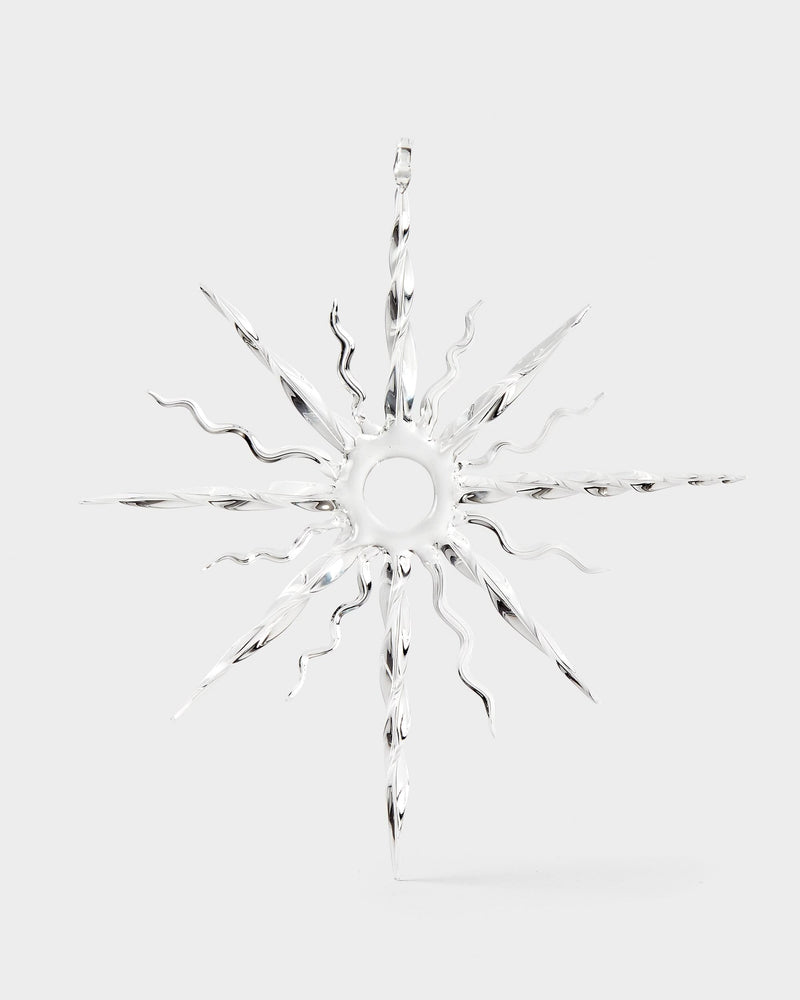 Clear glass snowflake ornament on a white background