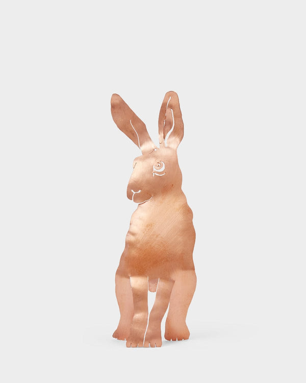 Copper hare figure on a white background