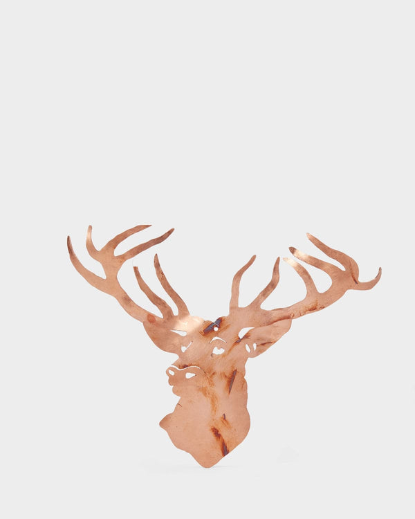 Decorative deer head with large antlers on a light gray background