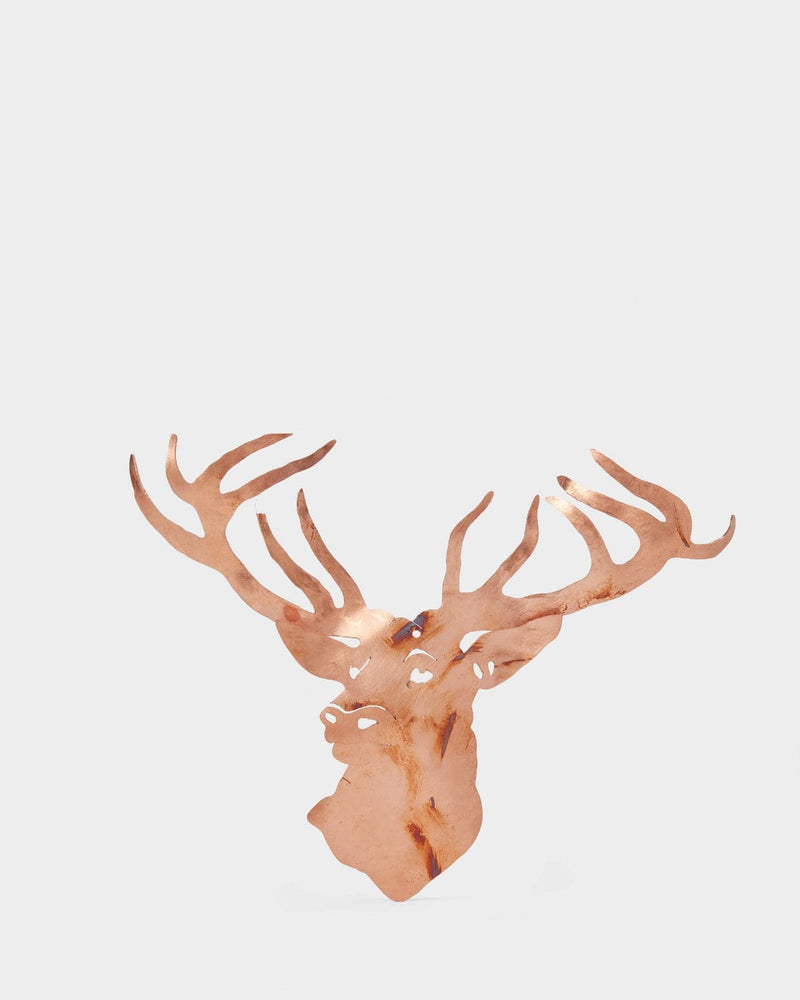 Decorative deer head with large antlers on a light gray background