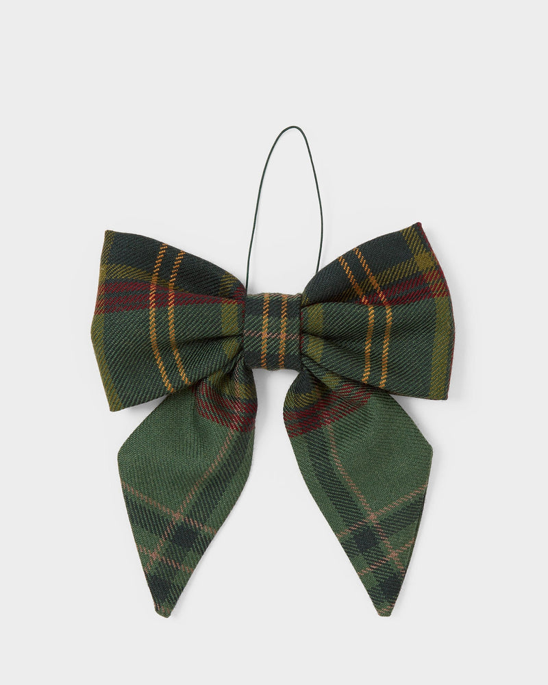 Green tartan bow decoration on a white background