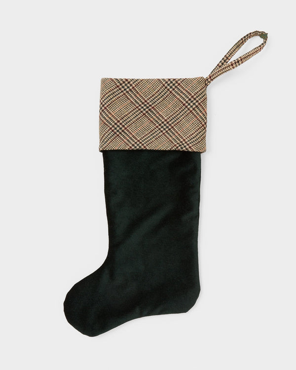 Black stocking with tweed top on a white background